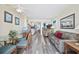 Bright living room featuring a dining area, wood floors, and access to the balcony at 200 76Th Ave. N # 1009, Myrtle Beach, SC 29572