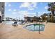 Resort-style outdoor pool with lounge chairs and jacuzzi at 200 76Th Ave. N # 1009, Myrtle Beach, SC 29572