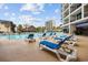 Resort-style outdoor pool with lounge chairs and tropical landscaping at 200 76Th Ave. N # 1009, Myrtle Beach, SC 29572