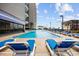 Resort-style outdoor pool with lounge chairs for relaxation at 200 76Th Ave. N # 1009, Myrtle Beach, SC 29572