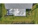 Aerial view of a backyard featuring a patio with dining and lounge areas and manicured landscaping and lawn at 2005 Tiller Ct., Myrtle Beach, SC 29579