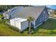 Aerial view showcases the covered patio with privacy panels and palm trees that enhance the backyard's appeal at 2005 Tiller Ct., Myrtle Beach, SC 29579