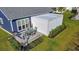 Aerial view of backyard featuring an outdoor kitchen with grill and dining set adjacent to the covered patio at 2005 Tiller Ct., Myrtle Beach, SC 29579