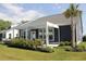 The backyard features a covered patio, an outdoor kitchen, and cozy seating, perfect for outdoor relaxation at 2005 Tiller Ct., Myrtle Beach, SC 29579