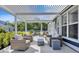 Covered patio featuring comfortable lounge seating, an outdoor kitchen, and a dining area perfect for entertaining at 2005 Tiller Ct., Myrtle Beach, SC 29579