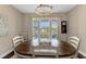 Bright dining area with a table and seating for six, illuminated by an elegant chandelier at 2005 Tiller Ct., Myrtle Beach, SC 29579