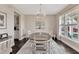 Dining room featuring an elegant chandelier, oval table with seating for six, and natural light at 2005 Tiller Ct., Myrtle Beach, SC 29579