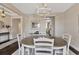 Open dining area with a table and seating for six, adjacent to the living and kitchen areas at 2005 Tiller Ct., Myrtle Beach, SC 29579