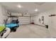 Spacious garage with a golf cart, storage cabinets, and ample space for vehicles at 2005 Tiller Ct., Myrtle Beach, SC 29579
