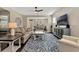 Inviting living room featuring neutral tones, comfortable seating, a ceiling fan, and an open floor plan at 2005 Tiller Ct., Myrtle Beach, SC 29579