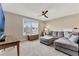 Comfortable living room with a large window, ceiling fan, and a sectional sofa at 2005 Tiller Ct., Myrtle Beach, SC 29579