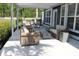 Covered patio with outdoor seating and a dining area for entertaining at 2005 Tiller Ct., Myrtle Beach, SC 29579
