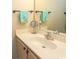 Light and airy bathroom showcasing a white countertop with a sink and light wood cabinets at 201 Landing Rd. # D, North Myrtle Beach, SC 29582