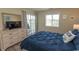 Relaxing bedroom features a beachy pillow, dresser, and sliding glass door to a balcony at 201 Landing Rd. # D, North Myrtle Beach, SC 29582