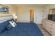 A cozy bedroom featuring a queen-sized bed with beach themed decor and calming colors at 201 Landing Rd. # D, North Myrtle Beach, SC 29582