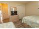 Charming bedroom with twin beds, dresser with television and closet with sliding doors at 201 Landing Rd. # D, North Myrtle Beach, SC 29582