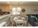 Cozy dining area features a wood table, four chairs, and overhead lighting fixture near the kitchen at 201 Landing Rd. # D, North Myrtle Beach, SC 29582