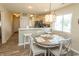 Inviting dining space boasts a wood table, seating for four, open to the kitchen and living spaces at 201 Landing Rd. # D, North Myrtle Beach, SC 29582