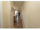 Bright hallway with wood floors provides access to the living areas and kitchen, creating an open flow at 201 Landing Rd. # D, North Myrtle Beach, SC 29582
