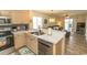 Bright kitchen with stainless steel appliances and breakfast bar overlooking the living area offers seamless entertaining at 201 Landing Rd. # D, North Myrtle Beach, SC 29582