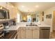 The kitchen has stainless steel appliances, a breakfast bar, and an open layout for seamless cooking and socializing at 201 Landing Rd. # D, North Myrtle Beach, SC 29582