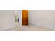 Hallway with a carpeted floor and a neutral wall, providing access to various rooms in the home at 2192 Highway 308, Galivants Ferry, SC 29544