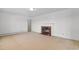 Living area with fireplace, carpet, and interior door at 2192 Highway 308, Galivants Ferry, SC 29544