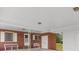 Covered patio with brick accents and white trim, offering a shaded area for outdoor relaxation and entertainment at 2192 Highway 308, Galivants Ferry, SC 29544