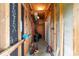Unfinished storage area with exposed beams, providing ample space for storing tools and equipment at 2192 Highway 308, Galivants Ferry, SC 29544