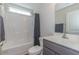 Bright bathroom with shower-tub combo, single sink vanity, and neutral walls at 247 Rolling Oak Dr., Georgetown, SC 29440