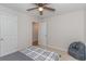 Carpeted bedroom features a bed, beanbag chair, ceiling fan, and access to other rooms at 247 Rolling Oak Dr., Georgetown, SC 29440