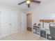 Bright bedroom with large closet, neutral walls, ceiling fan, and built in desk at 247 Rolling Oak Dr., Georgetown, SC 29440