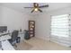Bedroom with desk, shelving, ceiling fan, and natural light at 247 Rolling Oak Dr., Georgetown, SC 29440