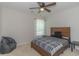 This carpeted bedroom has a wooden bed frame, bedside table, and a beanbag chair at 247 Rolling Oak Dr., Georgetown, SC 29440