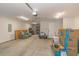 Spacious garage with concrete floor, overhead lighting, and ample storage space at 247 Rolling Oak Dr., Georgetown, SC 29440