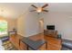 Bright living room boasts hardwood floors, vaulted ceiling with fan, and natural light at 247 Rolling Oak Dr., Georgetown, SC 29440
