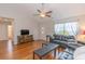 Comfortable living room with hardwood floors, vaulted ceilings, ceiling fan, and a view of the front door at 247 Rolling Oak Dr., Georgetown, SC 29440