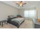 Spacious bedroom with tray ceiling, ceiling fan, and natural light at 247 Rolling Oak Dr., Georgetown, SC 29440