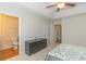 Bright bedroom with tray ceiling, ceiling fan, and ensuite bathroom at 247 Rolling Oak Dr., Georgetown, SC 29440