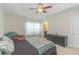 Large bedroom boasts tray ceiling, ceiling fan, sitting area, and dresser at 247 Rolling Oak Dr., Georgetown, SC 29440