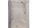 Walk-in shower features a shower head and built-in shelving at 247 Rolling Oak Dr., Georgetown, SC 29440