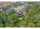 Aerial view of a home in a quiet neighborhood surrounded by trees, with a well-manicured lawn at 2615 Painted Trillium Ct., Myrtle Beach, SC 29579