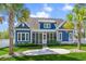 Charming home with a spacious screened-in porch, a well-maintained lawn, and a stone walkway at 2615 Painted Trillium Ct., Myrtle Beach, SC 29579