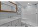 Clean bathroom with a white vanity, rope-framed mirror, and a shower with a glass door at 2615 Painted Trillium Ct., Myrtle Beach, SC 29579