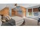 Stylish bedroom with an ocean mural accent wall, plush bedding, and window views at 2615 Painted Trillium Ct., Myrtle Beach, SC 29579