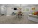 Cozy dining area with a round table, comfortable seating, and natural light at 2615 Painted Trillium Ct., Myrtle Beach, SC 29579