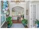 Elegant foyer featuring hardwood floors, arched entryway, and natural light, with open access to other rooms at 2615 Painted Trillium Ct., Myrtle Beach, SC 29579