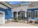 Charming front porch with flowers and architectural columns, providing a welcoming entrance to the home at 2615 Painted Trillium Ct., Myrtle Beach, SC 29579