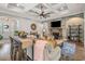 Bright living room with coffered ceilings, stone fireplace, modern furnishings, and bar seating area at 2615 Painted Trillium Ct., Myrtle Beach, SC 29579