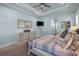 Calm main bedroom showcases a king bed, dresser, wood floors, light blue walls, and modern decor at 2615 Painted Trillium Ct., Myrtle Beach, SC 29579